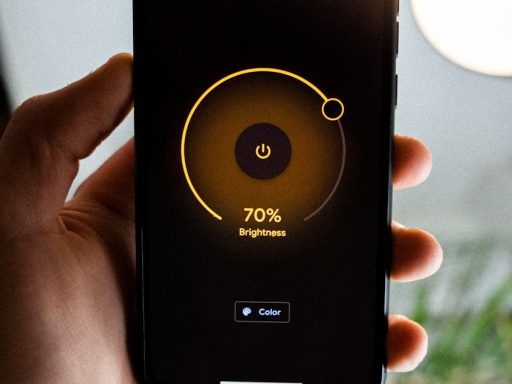 person holding black iphone 4