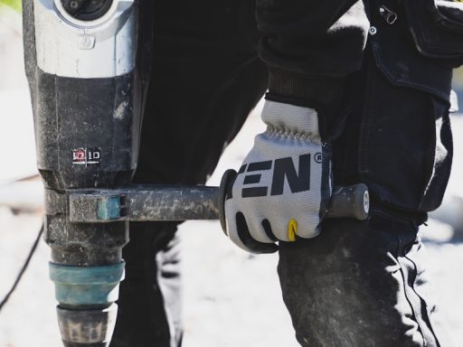 a close up of a person holding a drill